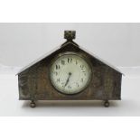 An early 20th century mantel clock, the white dial with Arabic numerals denoting hours, housed in
