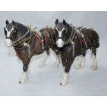 Two Beswick Clydesdale Horses in working harnesses, model No. 2465, chocolate brown matt. Beswick