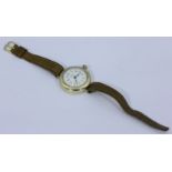 A gents 9ct gold J.W.Benson wristwatch on a leather strap, hallmarked 1915