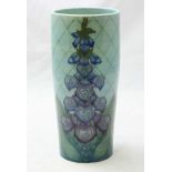 A Dennis Chinaworks vase of tapering cylindrical form, with a foxglove design to a turquoise ground.