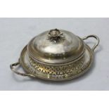 A Victorian silver butter dish by Henry Wilkinson & Co. the cover with floral carved decoration,