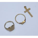 A 9ct gold signet ring, together with a 9ct gold crucifix and another yellow metal ring,