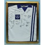 A signed and framed retro Portsmouth FC shirt, white with blue crest, collar and two vertical