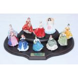 Ten assorted Royal Doulton ceramic 'Miniature Ladies.' Nine in original boxes, together with display