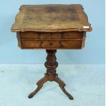 A Victorian walnut work table of rectangular form with serpentine edges, the top lifting to reveal a