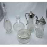 A small collection of assorted cut glass items including two decanters and stoppers, two jugs and