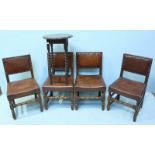 A set of four oak standard chairs, with brown leather upholstery, metal studded detailing and raised