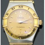 A ladies quartz Omega Constellation wristwatch, reference 6553/865. The textured gold dial with