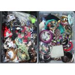 A large quantity of assorted costume jewellery including bangles, necklaces, beads and bracelets