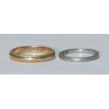 An unmarked gold wedding ring, tests as 14ct or above, 5.04grams, ring size 'P,' together with a
