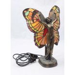 An Art Deco style figural lamp by Widdop Bingham and co. modelled as a winged lady. 40cm high.