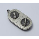 A four dial G & J W Hawksley 'Norfolk Liar' game counter of oblong form, the nickel side with