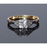 An 18ct gold and platinum diamond ring, centrally claw set with a solitaire RBC diamond, estimated