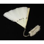 An ivory and white feather fan, with tassels and pierced and carved design of figures, foliage and