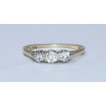 An 18ct gold three-stone diamond ring, estimated total diamond weight approximately 0.35-0.40cts.