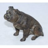 A late 19th century cold-painted hollow-cast spelter figure of a seated Bulldog