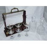 Two various cut glass decanters, a three-decanter locking Tantalus (lacking decanters) and six