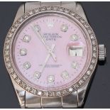 A stainless steel Rolex 'Date' wristwatch c.1970. The pearlescent pink dial with diamond dot markers