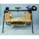 A Record Power woodworking lathe on stand together with various chucks, accessories and chisels etc