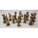 A collection of twelve assorted Goebel ceramic figures.