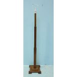 An Art Deco wooden lamp stand with stepped square base, approximately 150cm high