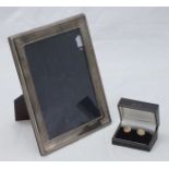 A silver picture frame, overall measurements 22 x 17cm, together with a pair of 9ct child's