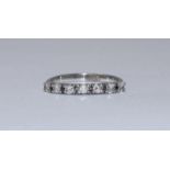 A white metal ring claw set with seven RBC diamonds. Total diamond weight approximately 0.40cts+.