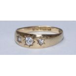 An 18ct gold and diamond ring, gypsy set with three RBC diamonds. Total diamond weight approximately
