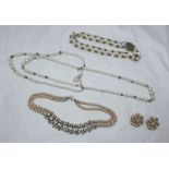 Three various pearl necklaces and a pair of clip-on pearl earrings