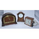 An art deco Ismay Synchronous electric clock and an oak-cased 1930s mantel clock together with a