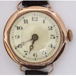 A ladies 9ct gold cocktail watch, the cream dial with Arabic numerals denoting hours and on