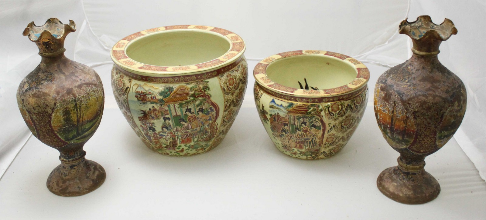 A pair of unusual vases made from vellum or hide, with crimped rims and the sides decorated with