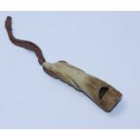An Edwardian novelty antler-carved dog whistle carved with a hunting dogs head