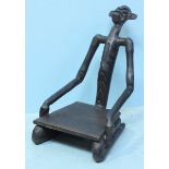 An African hardwood chair carved in the shape of a kneeling man
