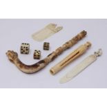 An early 20th century ivory book mark with 'Snake Charmer' finial and another with 'Blood Hound'