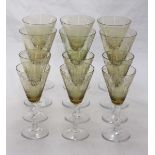 Two sets of six each large and smaller hock wine glasses, with pale green conical bowls with