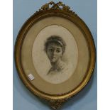 A late Victorian head and shoulders portrait of a young girl, signed 'Nellie Noel, 1894,' in oval