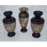 A pair of Royal Doulton stoneware pottery vases of tapered form with flared rim and turned,