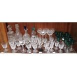 A good quantity of assorted cut glass including four decanters and a set of twelve green coloured