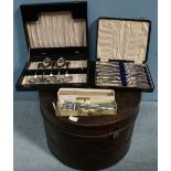 A cased set of five silver-plated spoons, together with a cased set of twelve fish knives and