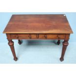 A 19th century stained walnut two drawer side table, raised on turned, fluted supports. 90cm wide.