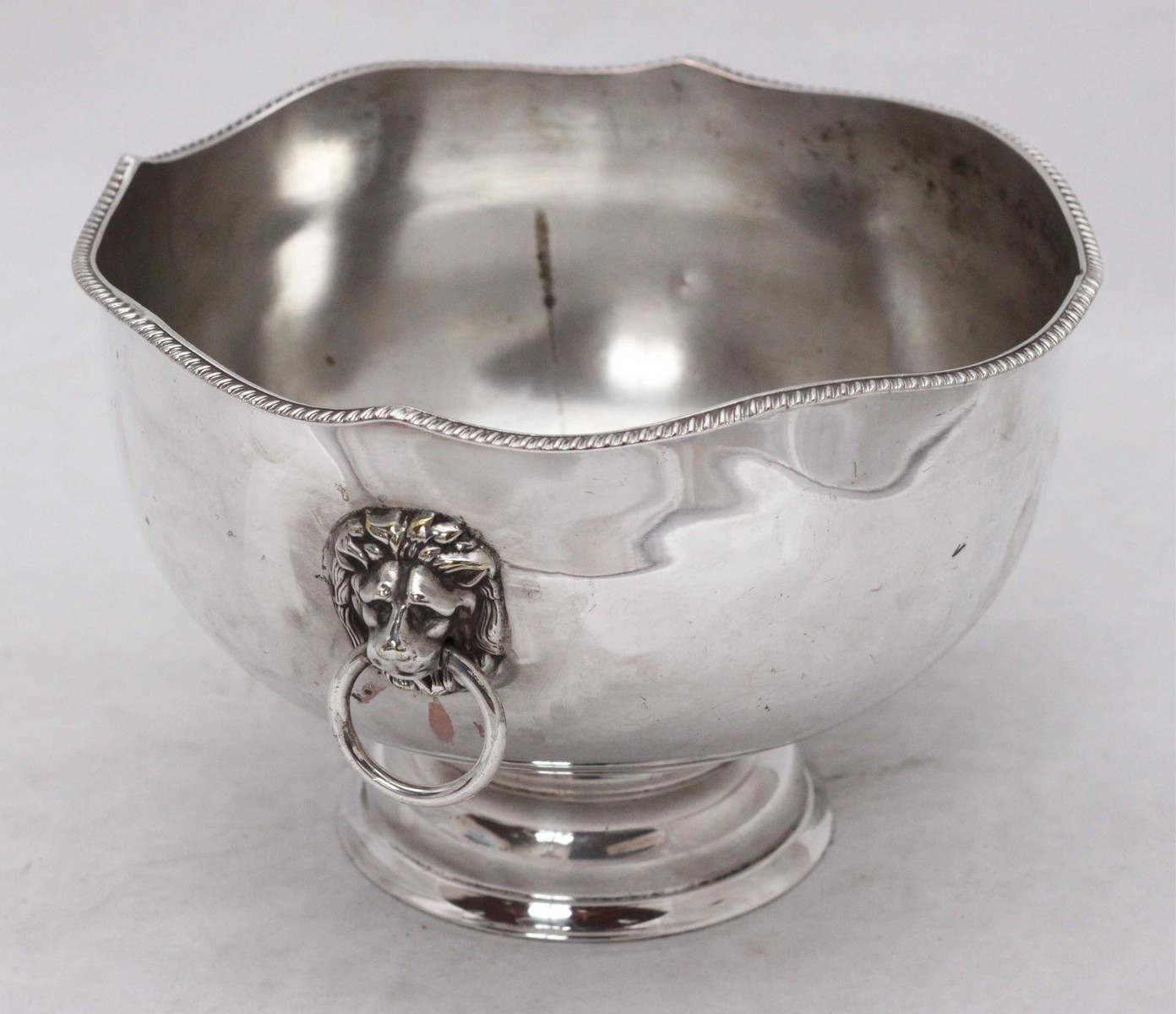 A large silver plated ice bucket with gadrooned shaped rim and lion mask handles on circular - Image 2 of 4