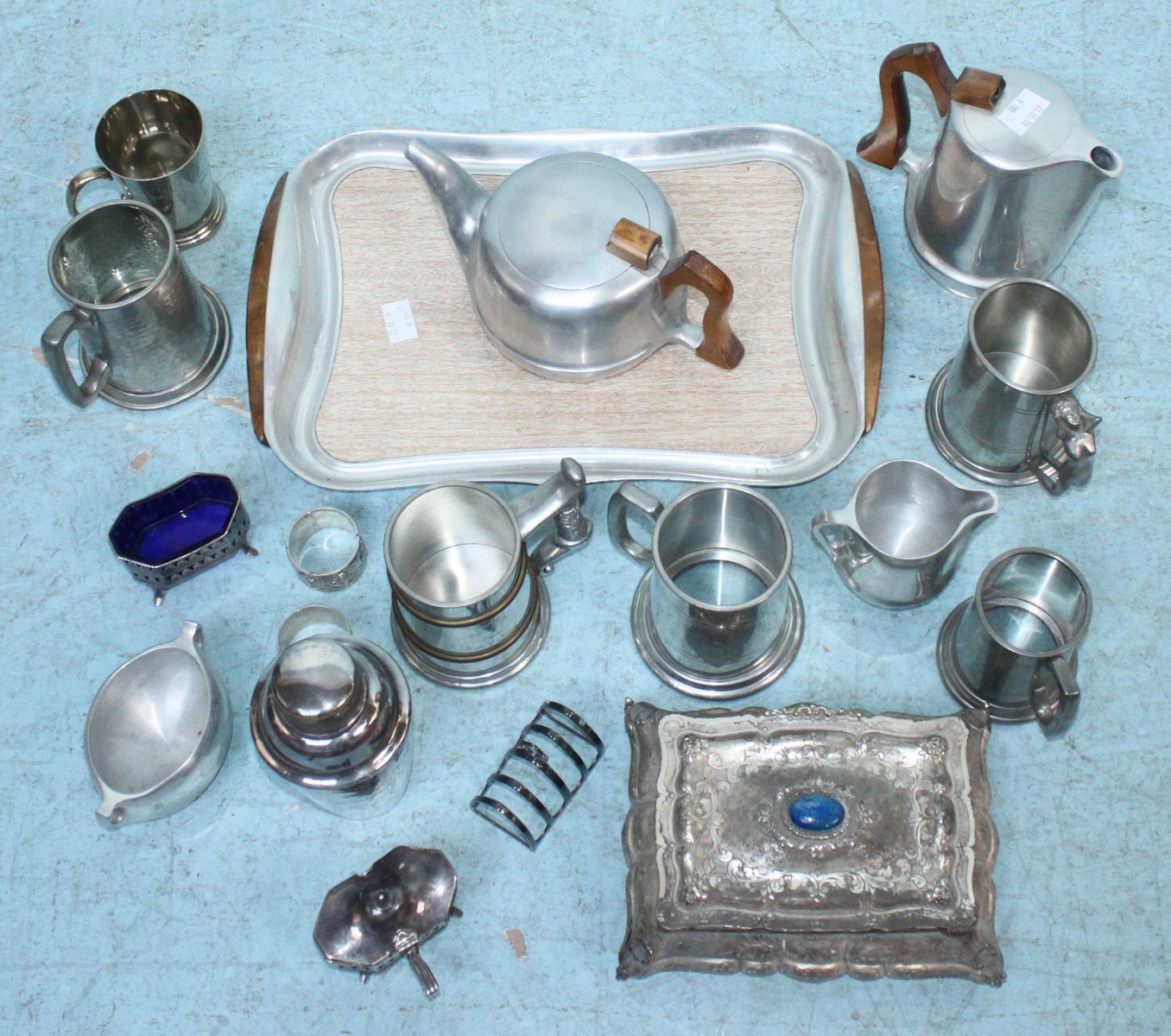 A quantity of assorted silver-plate and pewter wares including tankards and a Picquot Ware tea set