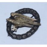 A WW2 German LuftWaffe Fallschirmjager badge, the back stamped 'G.E. Junker, Berlin, SW'