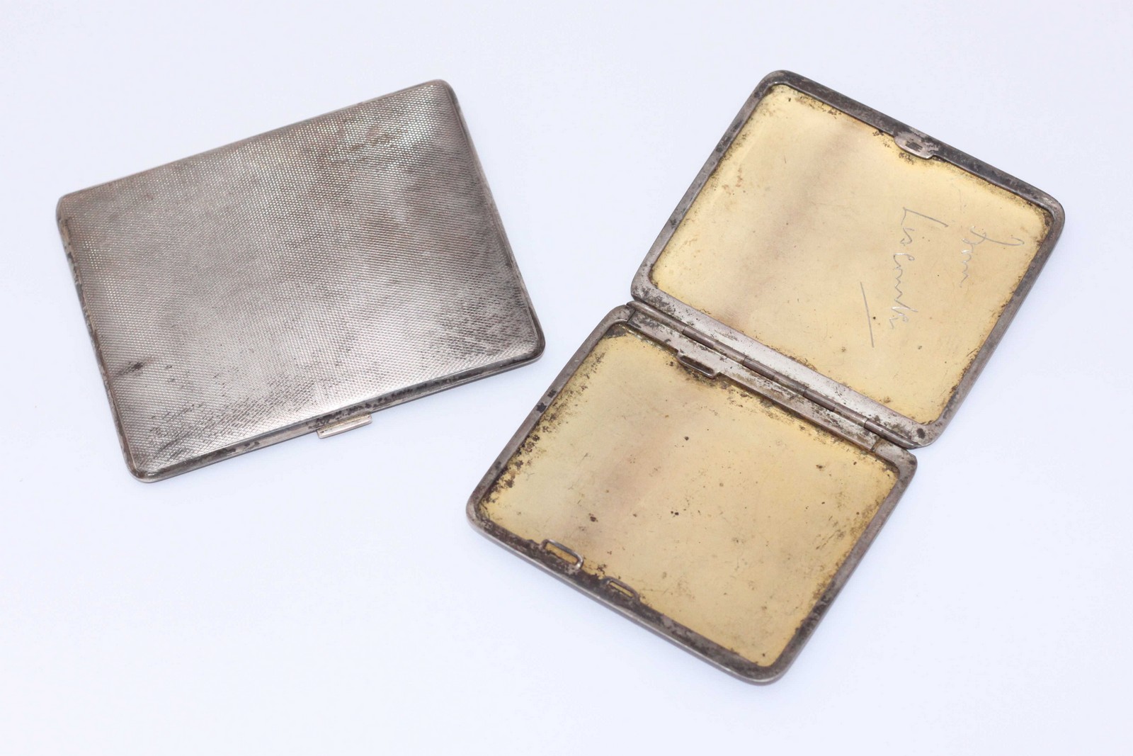 Two various silver cigarette cases, one by the Goldsmiths and Silversmiths co. ltd. Gross weight