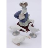 A Lladro porcelain figure 'Pretty Pickings' Model No.5222, together with two Lladro figures of geese