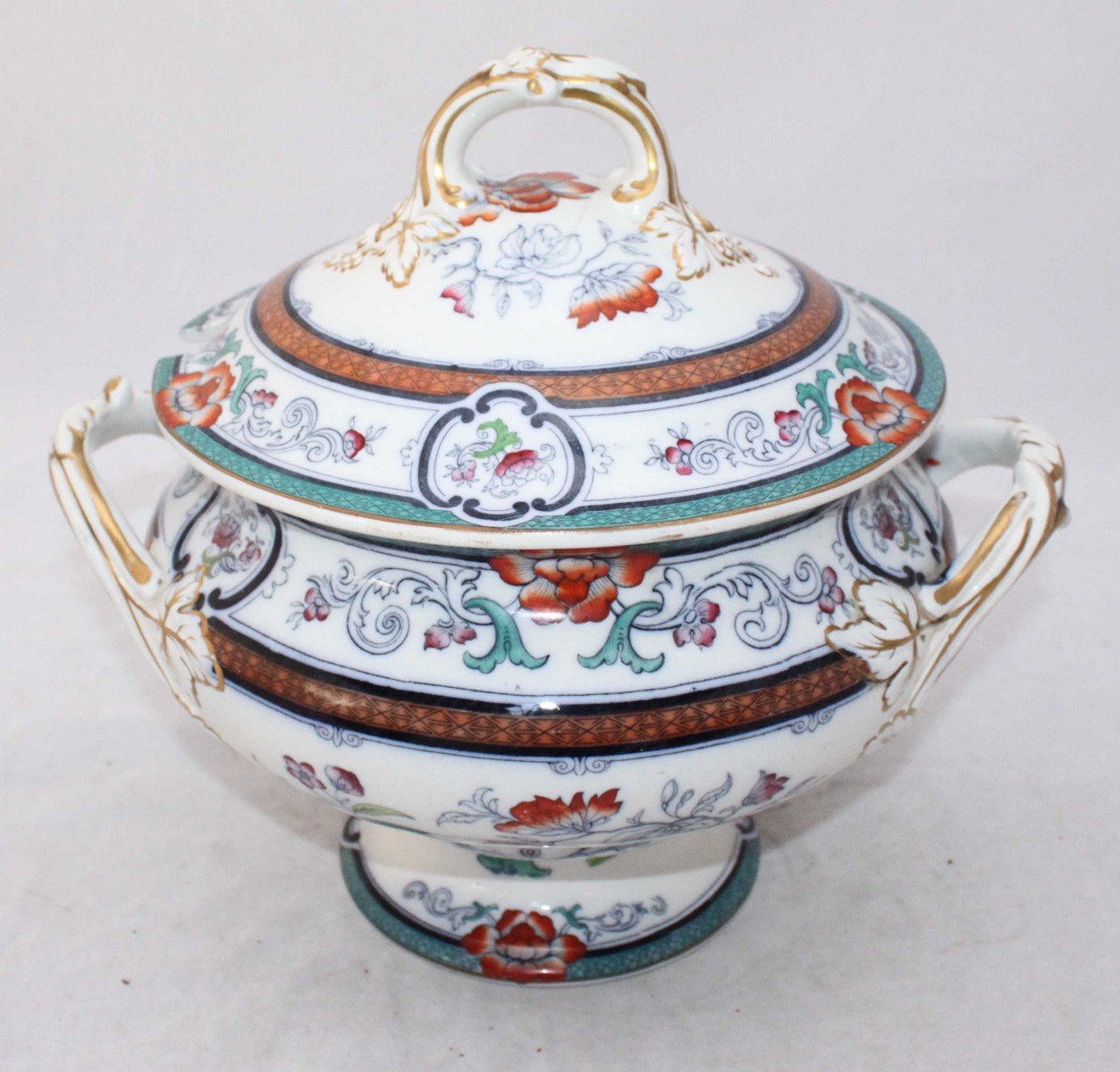 A large TC Brown Westhead Moore & co. casserole tureen and cover, with floral and gilt decoration.