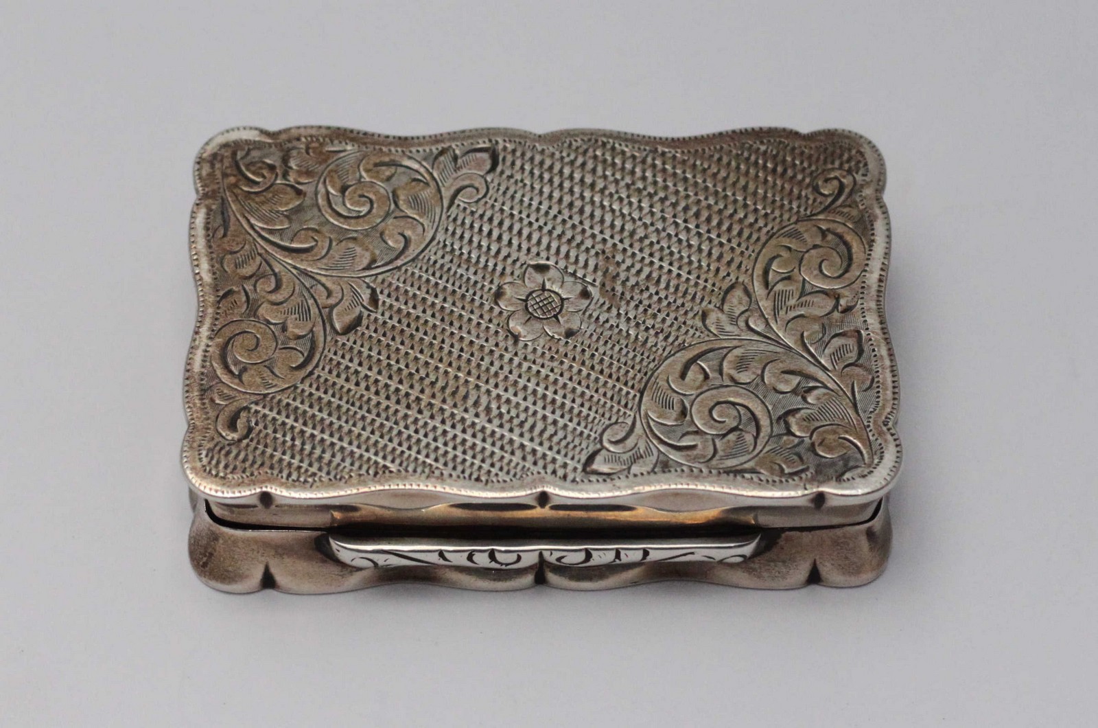 A 19th century silver snuff box of rectangular form with hinged cover, engine turned and engraved - Image 3 of 3