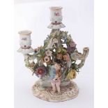 A 19th century Meissen porcelain three-light candelabra, ornately decorated with moulded and painted