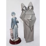 A Lladro porcelain figure 'Charlie the Tramp' no.5233, on turned wooden base, 28cm high excluding